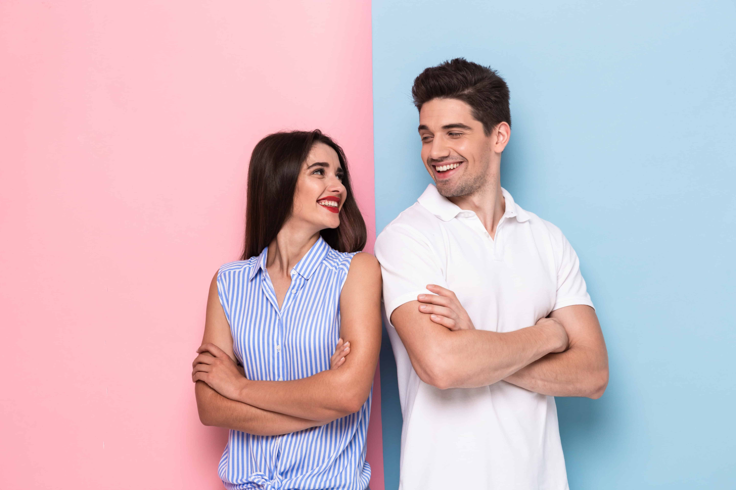 A couple standing in the traditional colors that relate to their sexual identity. The white guy has a blue background and the white girl has a pink background. These two are thinking about becoming sexual partners.