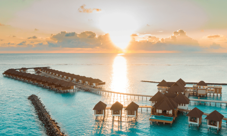 a view of the ocean surrounded by different homes off of the water.