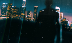 A person in a big city but all alone.