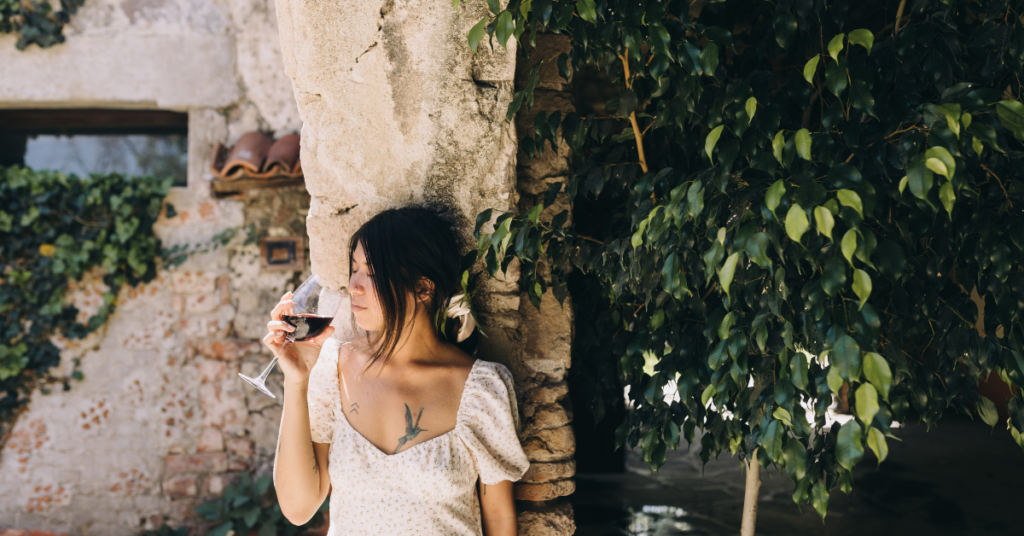Woman drinking wine after facing a rejection