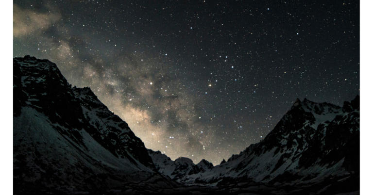 Picture of a background that is open space with a mountain as the view.