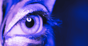 There is a woman with an eye. Looking out of the window