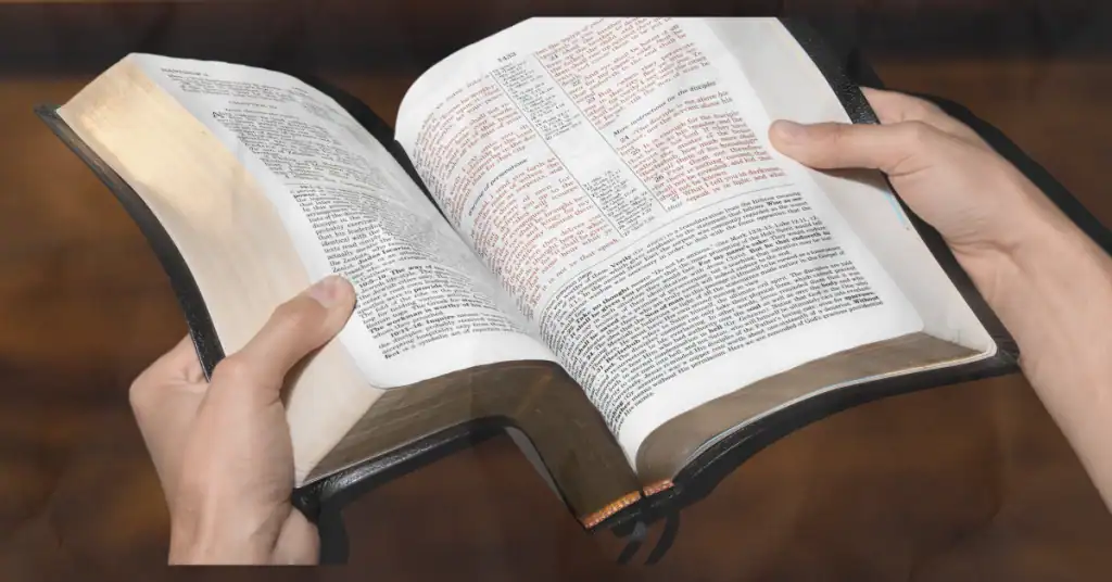 a man holding the bible learning how to build a biblical marriage